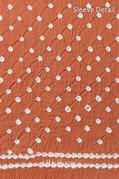 Bandhani dotted sleeve pattern on mercerised cotton fabric with handcrafted tie dye work.
