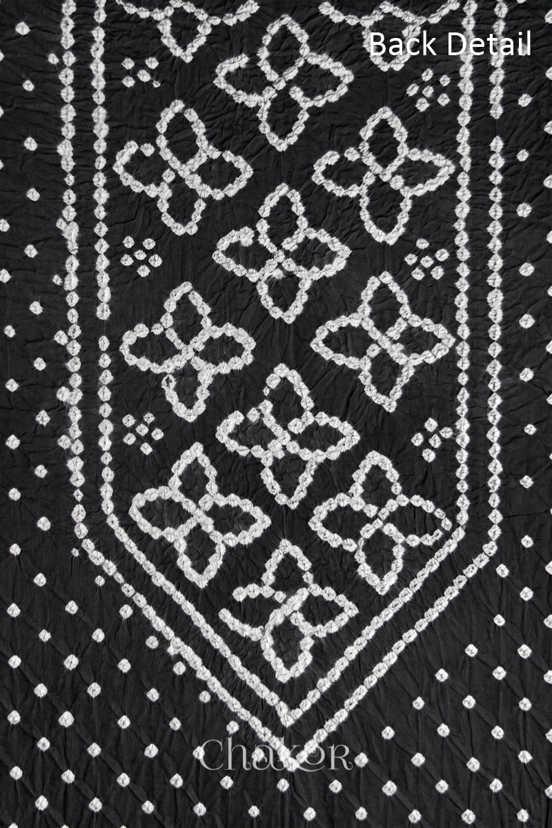 Back yoke detail featuring traditional Bandhani floral motifs on Black cotton fabric.
