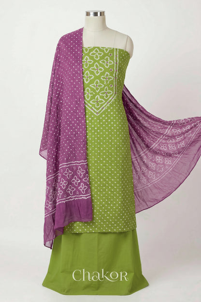 Green Kutch Bandhani cotton unstitched suit set, mirror work kurta with Mauve mulmul cotton dupatta.

