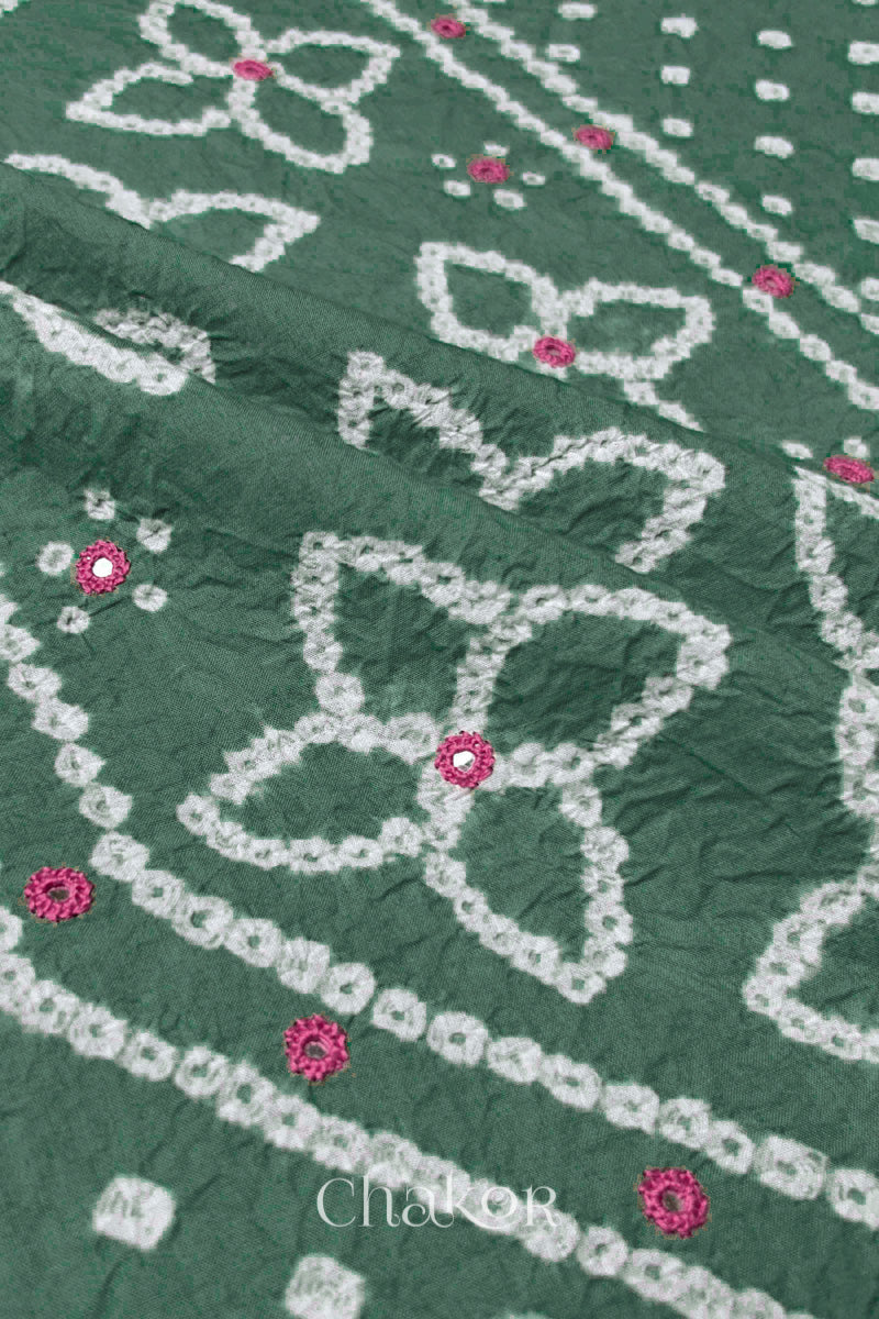 Hand tied Bandhani floral motif with colourful mirror embroidery on Moss Green cotton fabric.
