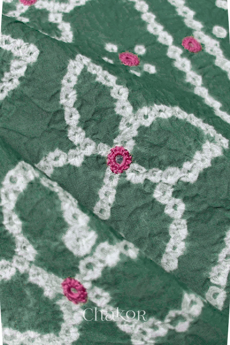 Close-up of Bandhani floral pattern accented with hand embroidered mirror work.
