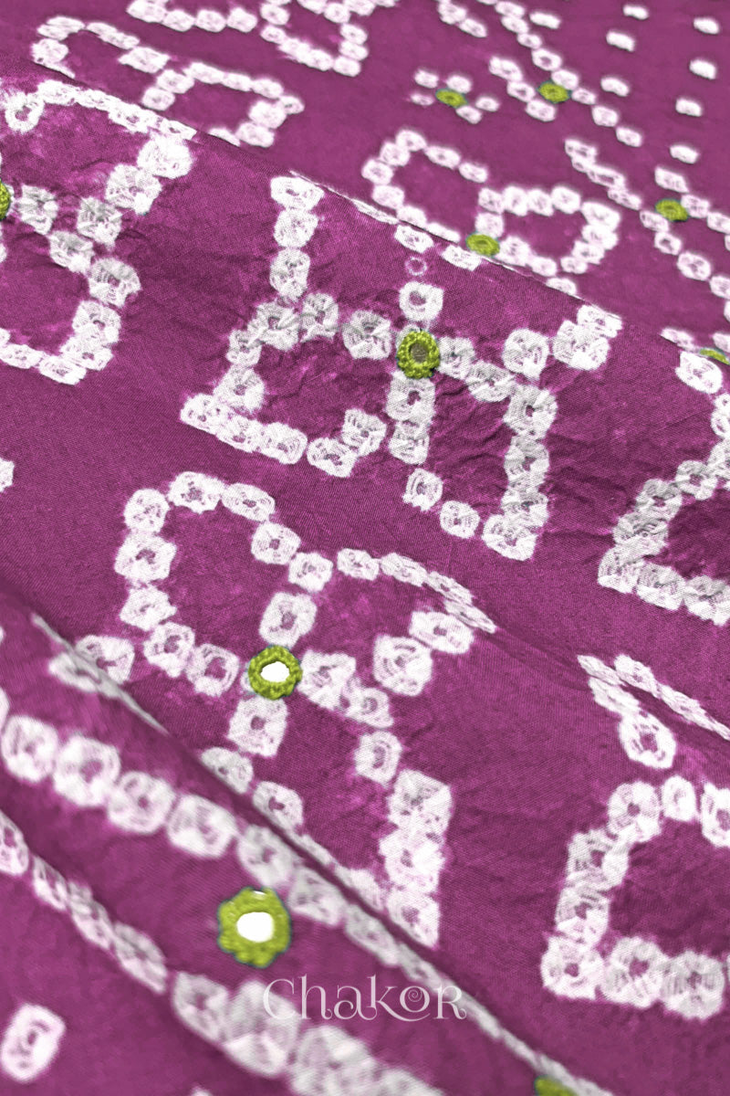 Hand tied Bandhani floral motif with colourful mirror embroidery on Mauve cotton fabric.
