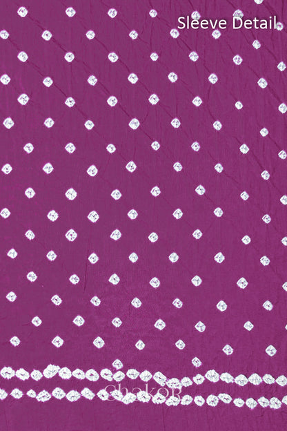 Bandhani dotted sleeve pattern on mercerised cotton fabric with handcrafted tie dye work.
