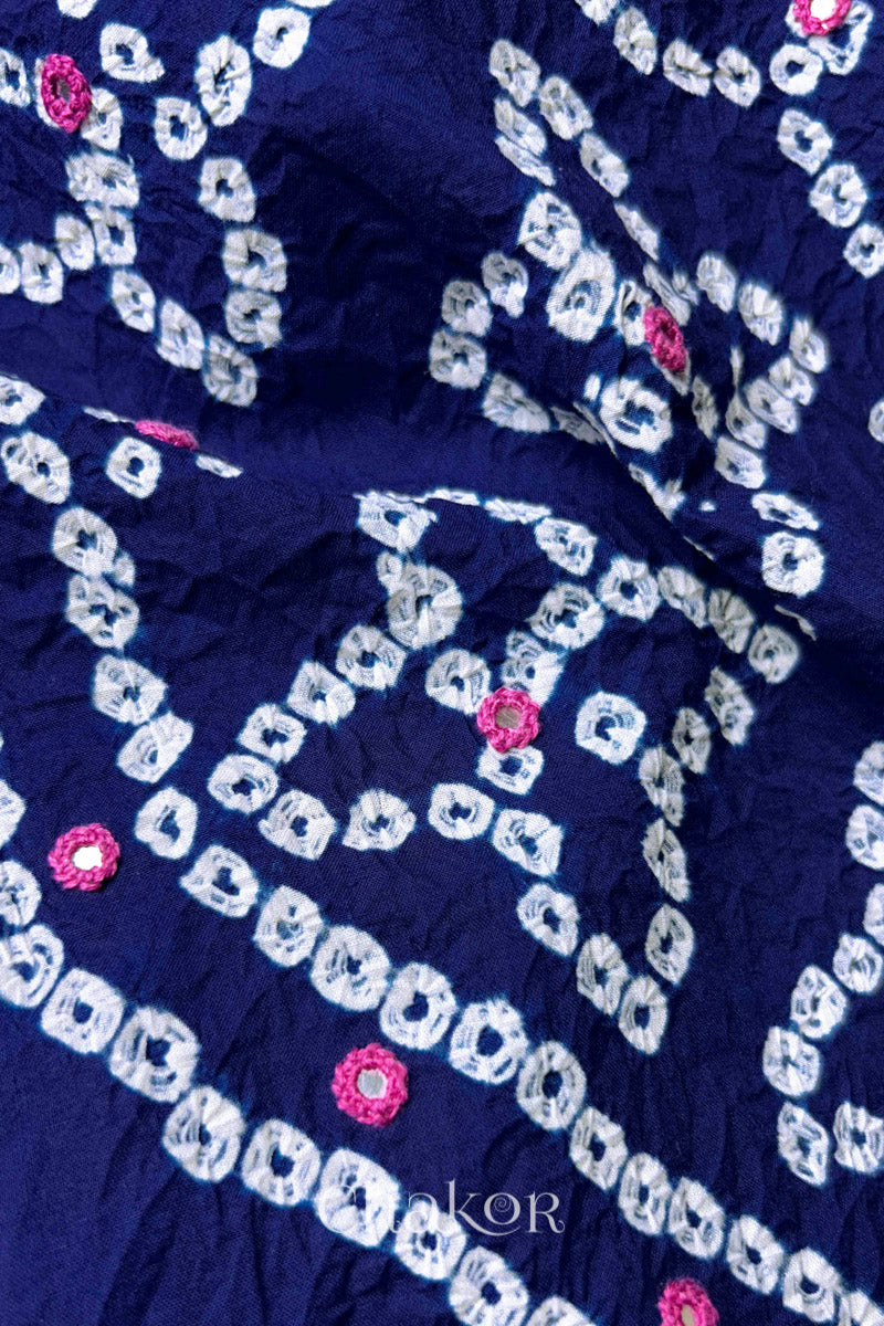 Close-up of Bandhani floral pattern accented with hand embroidered mirror work.
