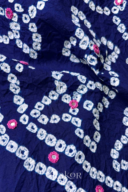 Close-up of Bandhani floral pattern accented with hand embroidered mirror work.
