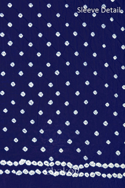Bandhani dotted sleeve pattern on mercerised cotton fabric with handcrafted tie dye work.
