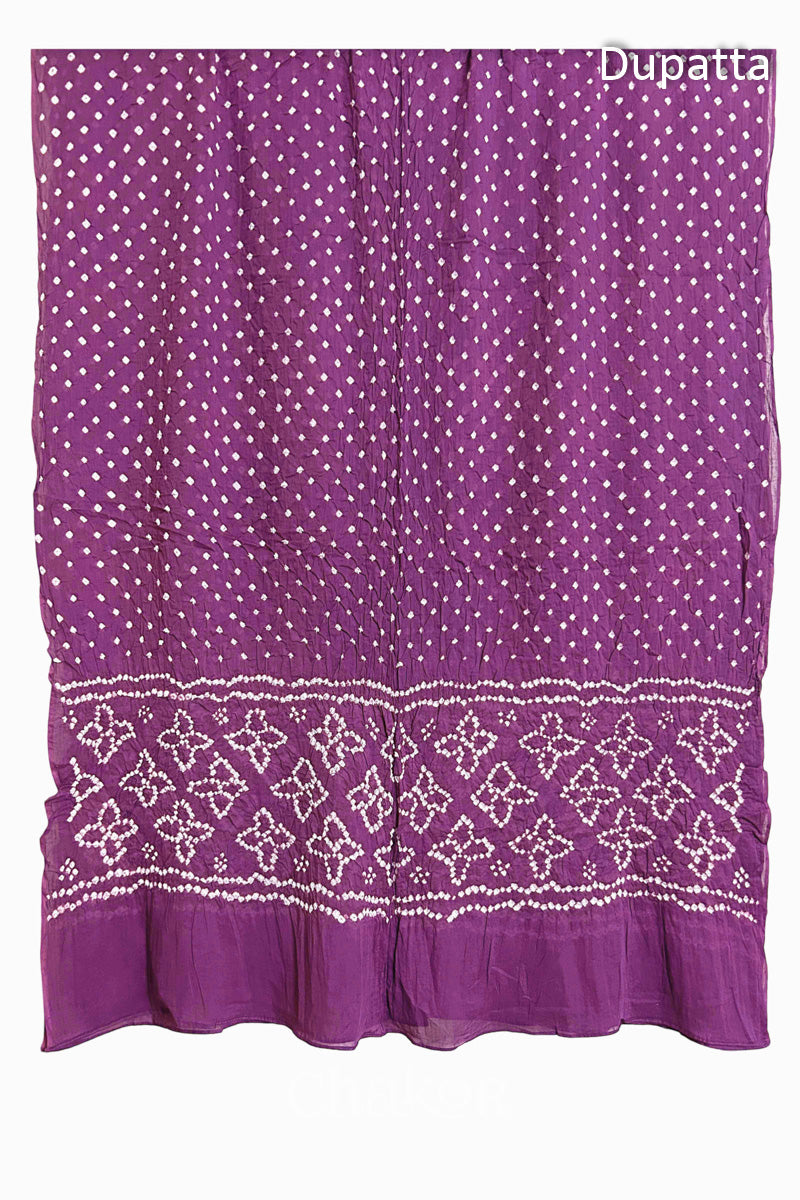 Full view of Mauve Bandhani mulmul cotton dupatta with floral pallu and dotted body pattern.
