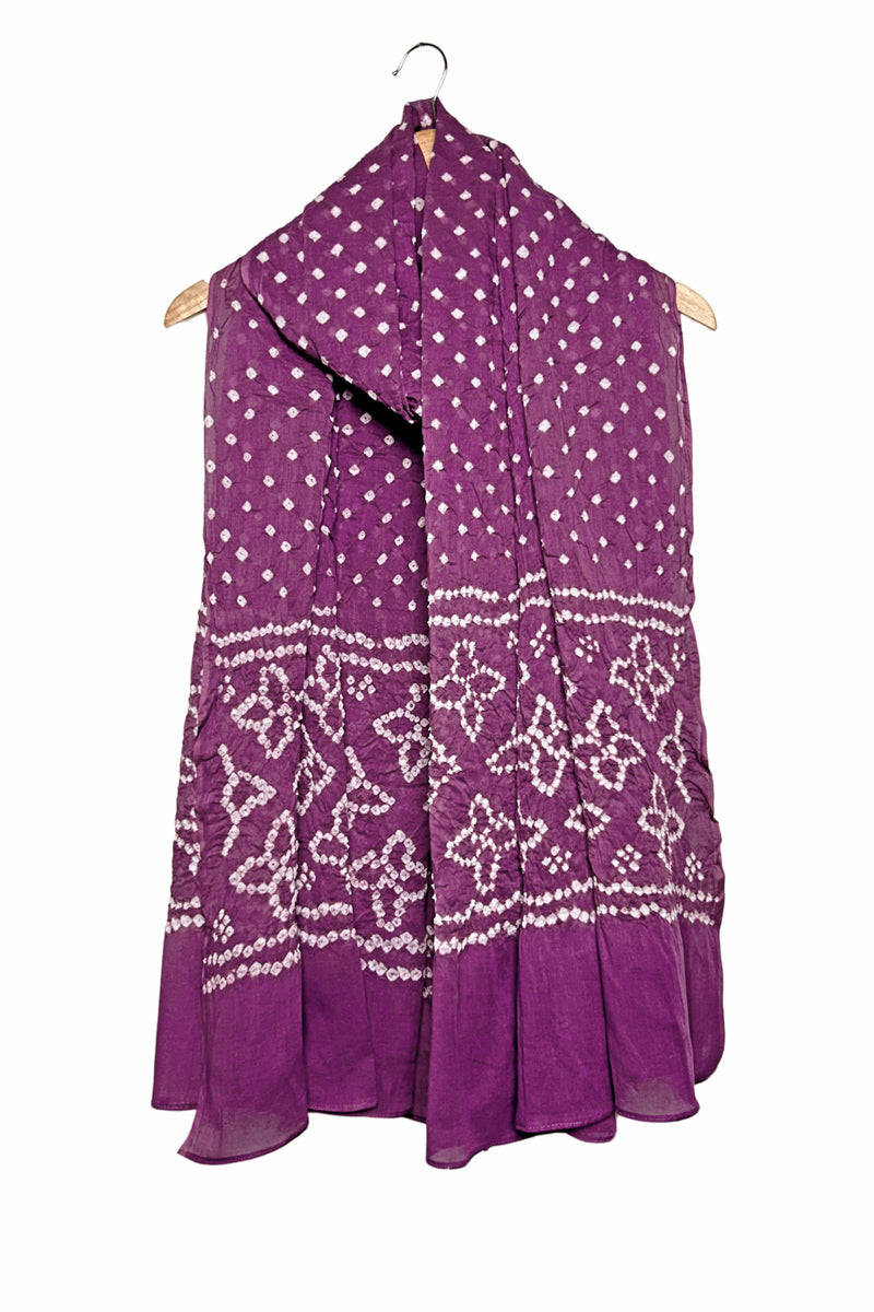 Mauve mercerised mulmul cotton dupatta with Bandhani floral pallu design draped on hanger.
