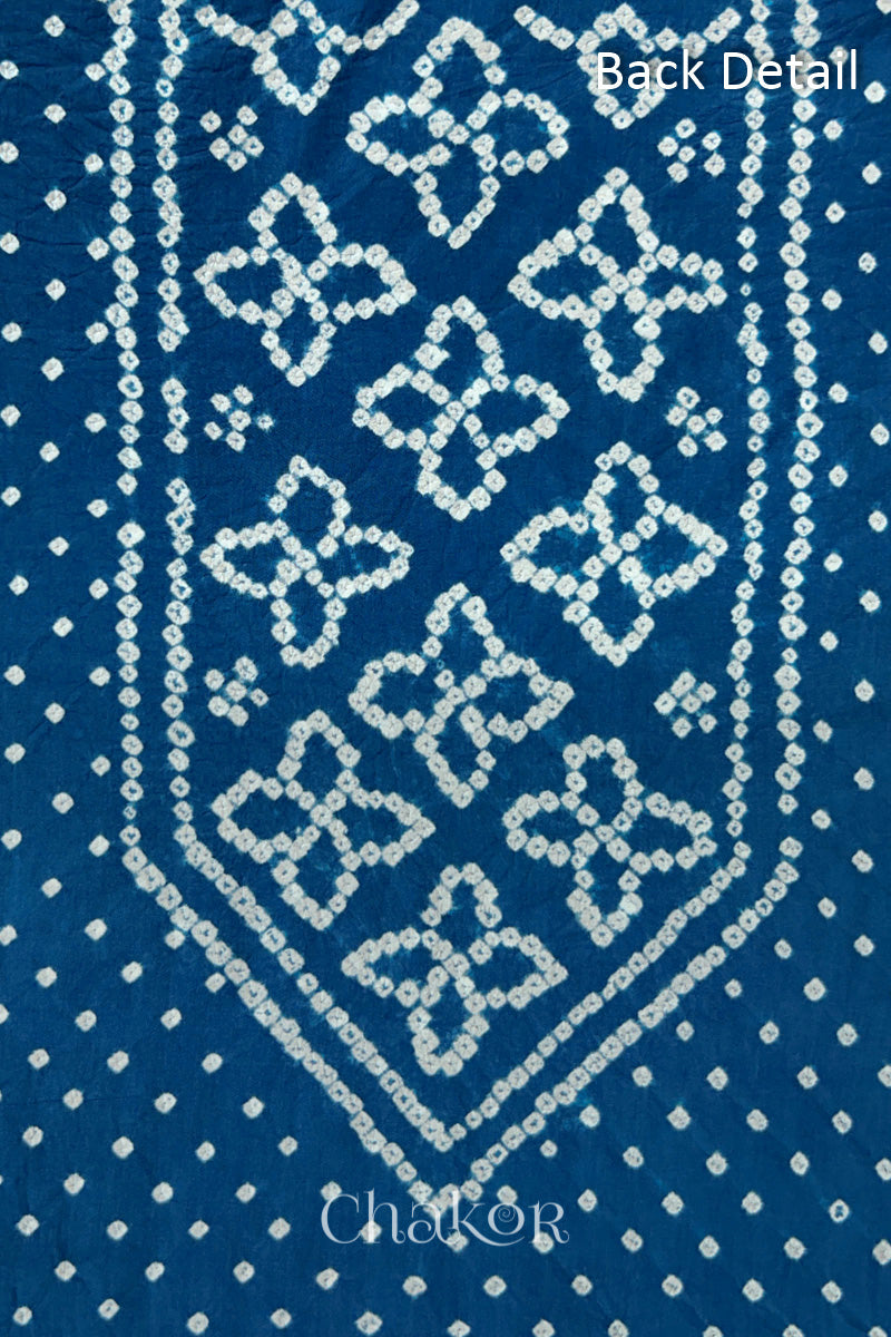 Back yoke detail featuring traditional Bandhani floral motifs on Indigo Blue cotton fabric.
