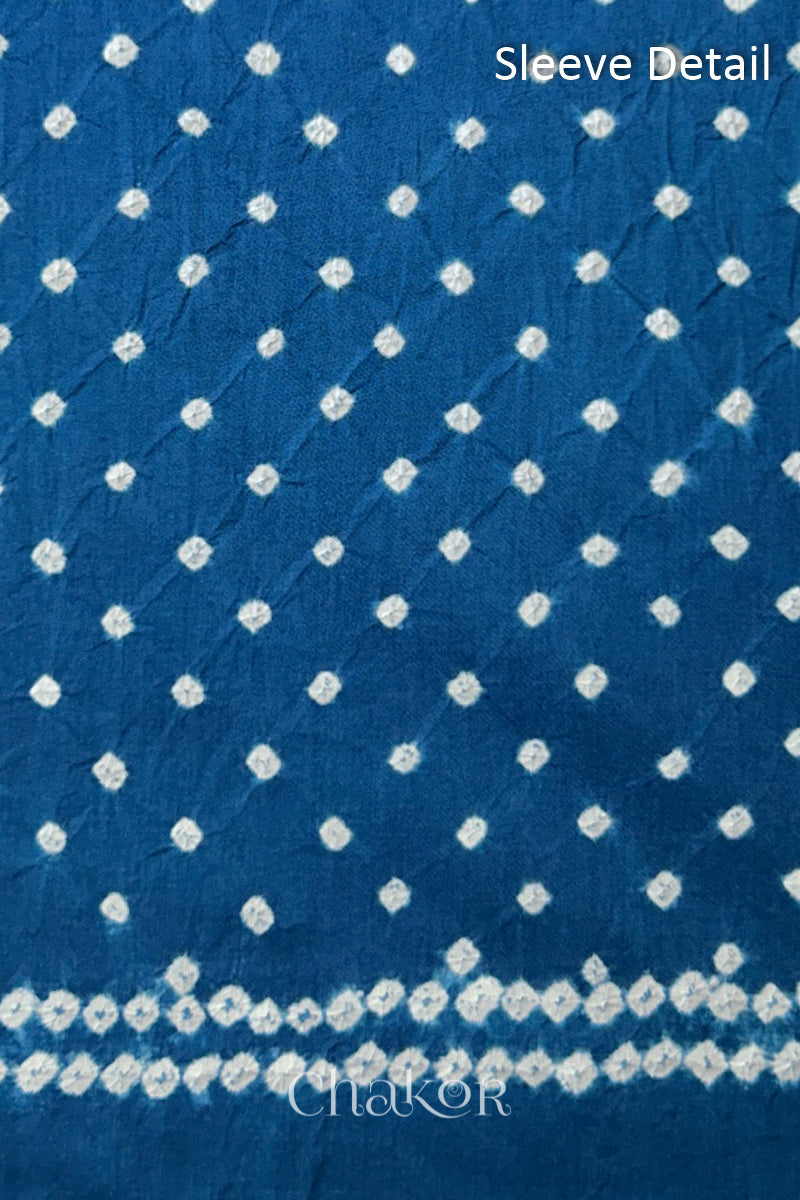 Bandhani dotted sleeve pattern on mercerised cotton fabric with handcrafted tie dye work.
