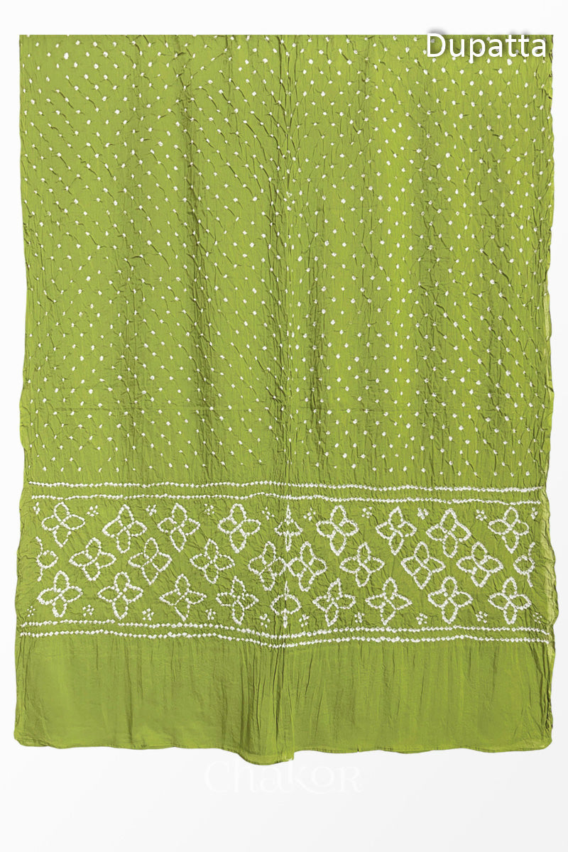 Full view of Lime Green Bandhani mulmul cotton dupatta with floral pallu and dotted body pattern.
