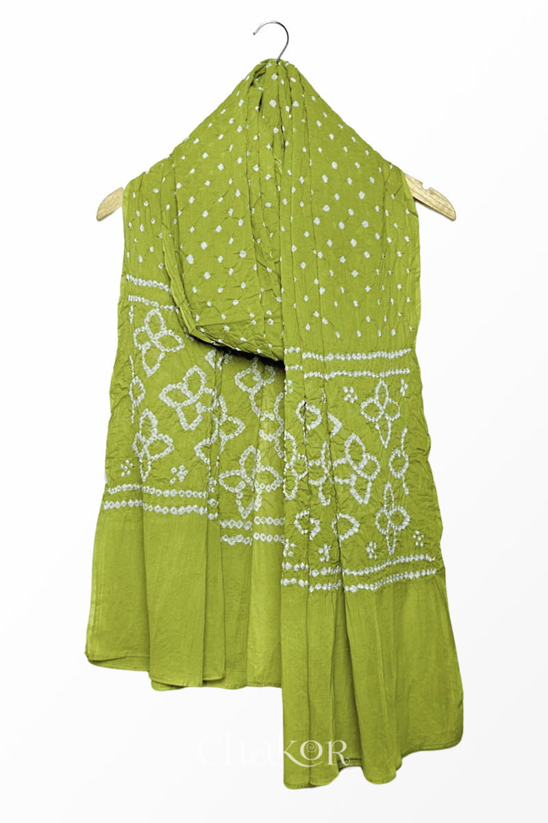 Lime Green mercerised mulmul cotton dupatta with Bandhani floral pallu design draped on hanger.
