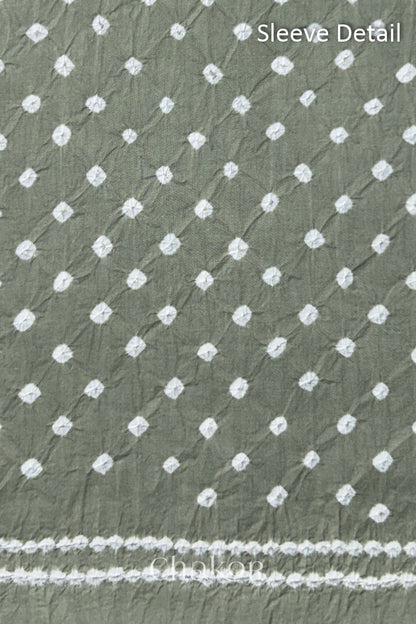 Bandhani dotted sleeve pattern on mercerised cotton fabric with handcrafted tie dye work.
