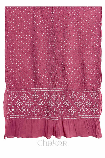 Full view of Rose Pink Bandhani mulmul cotton dupatta with floral pallu and dotted body pattern.
