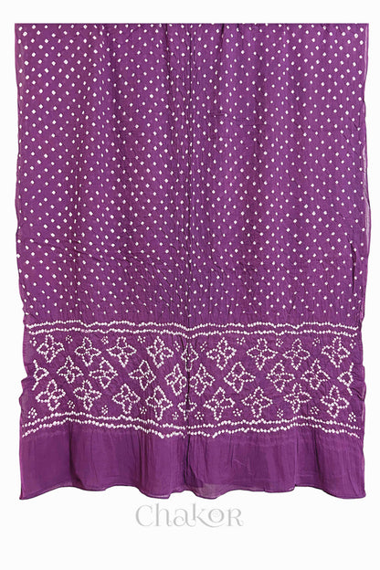 Full view of Mauve Bandhani mulmul cotton dupatta with floral pallu and dotted body pattern.
