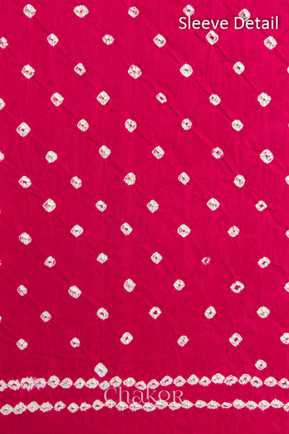 Bandhani dotted sleeve pattern on mercerised cotton fabric with handcrafted tie dye work.
