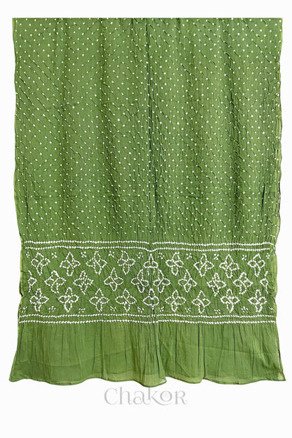 Full view of Green Bandhani mulmul cotton dupatta with floral pallu and dotted body pattern.
