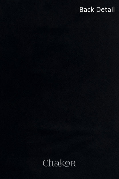 Close-up of plain back of the kurta fabric with Chakor brand watermark. Text reads back detail.
