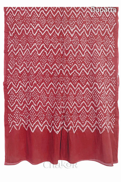 Full view of the dusty red dupatta from the kurta set with intricate zigzag bandhani patterns, with Chakor watermark. The design showcases artisanal craftsmanship.

