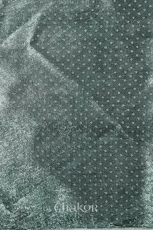 Charcoal grey mashru self textured fabric with 'Chakor' logo visible.
