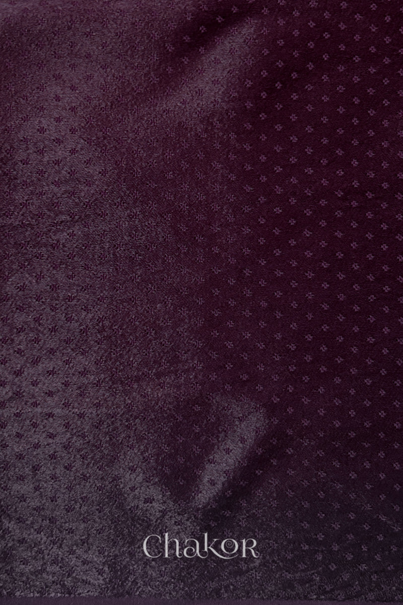dark burgundy mashru self textured fabric with 'Chakor' logo visible.