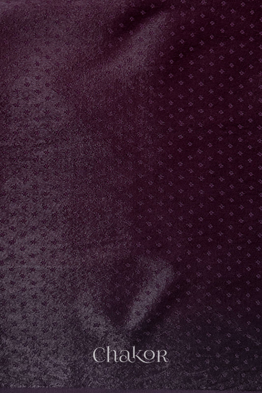 dark burgundy mashru self textured fabric with 'Chakor' logo visible.