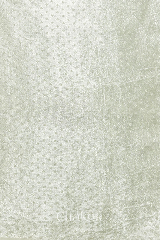 Off-white mashru self textured fabric with 'Chakor' logo visible.