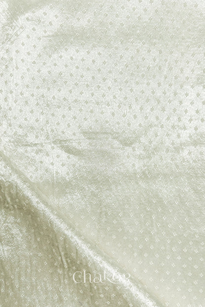 Off-white mashru self textured fabric with folded corner & Chakor brand watermark.
