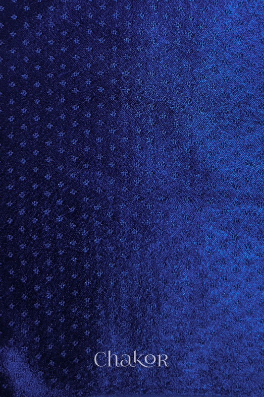 Royal blue mashru self textured fabric with 'Chakor' logo visible.