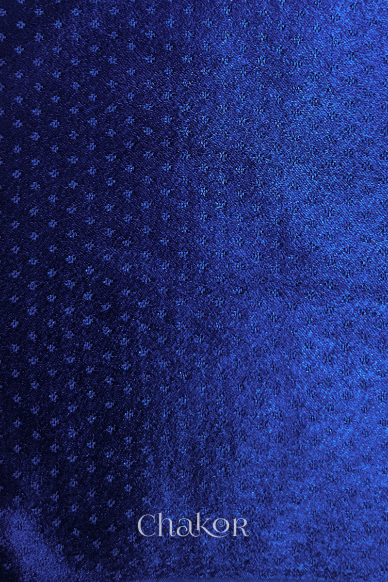 Royal blue mashru self textured fabric with 'Chakor' logo visible.