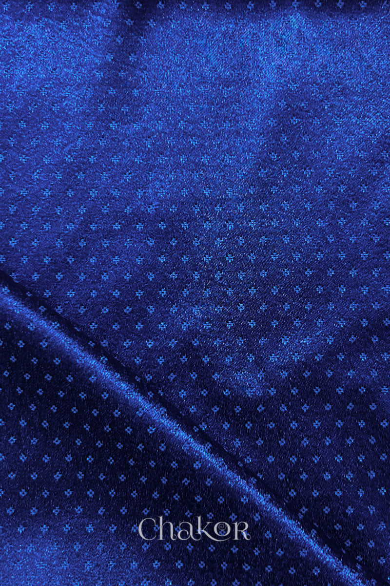 Royal blue mashru self textured fabric with folded corner & Chakor brand watermark.