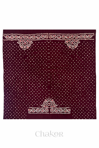 Full 1-metre layout of Maroon Popat Bandhani blouse piece showing back and sleeve motif placement.
