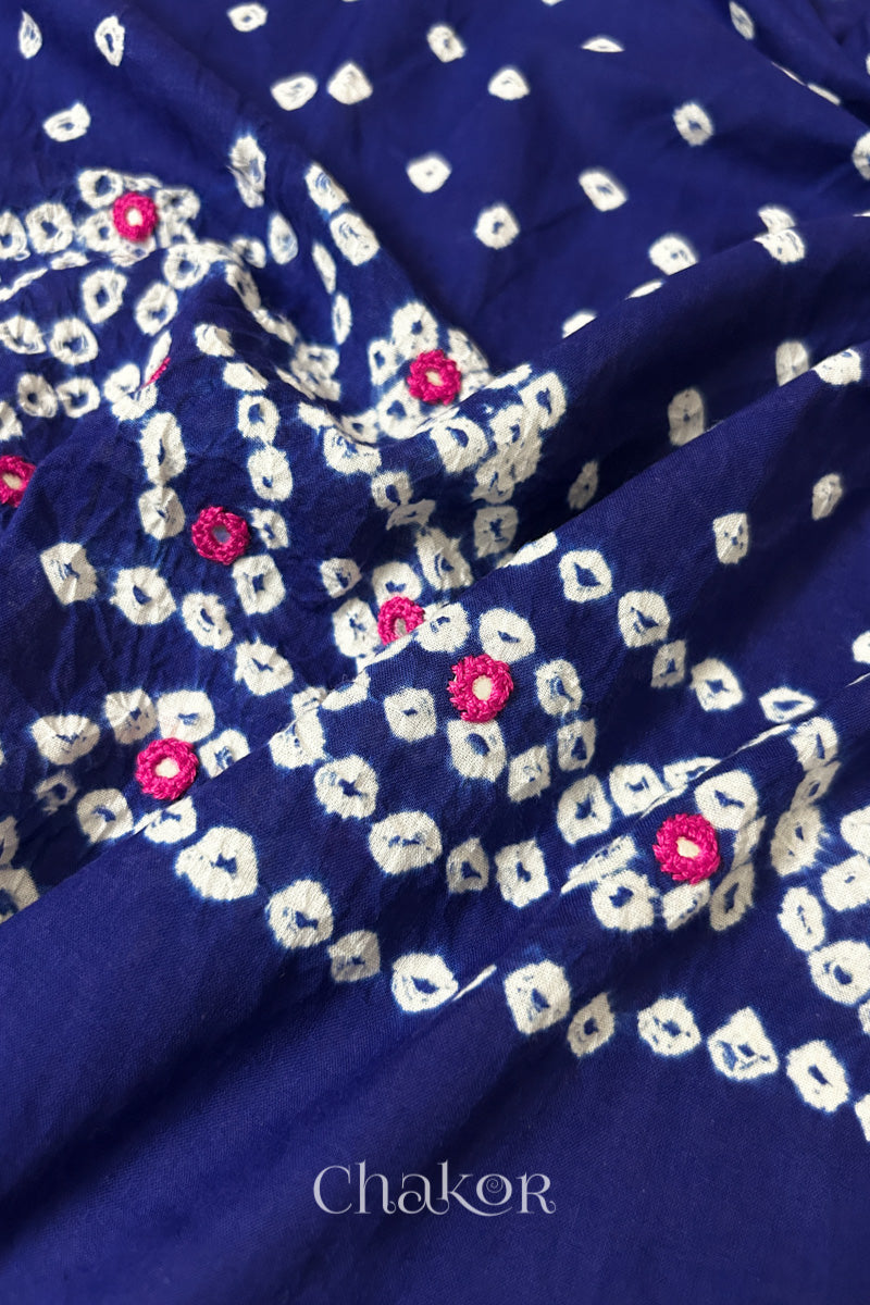 Detailed Popat Bandhani pattern with hand-embroidered mirrors on Navy blue cambric cotton blouse piece.
