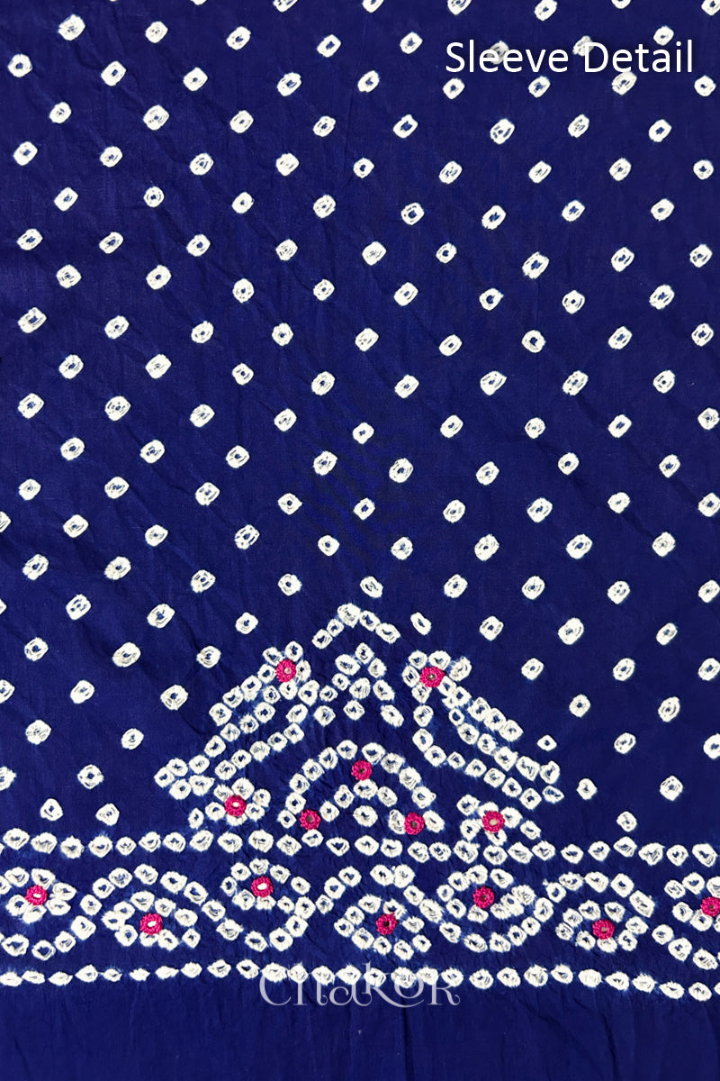 Popat Bandhani parrot motifs and mirror work designed for the sleeve of a Navy blue blouse.
