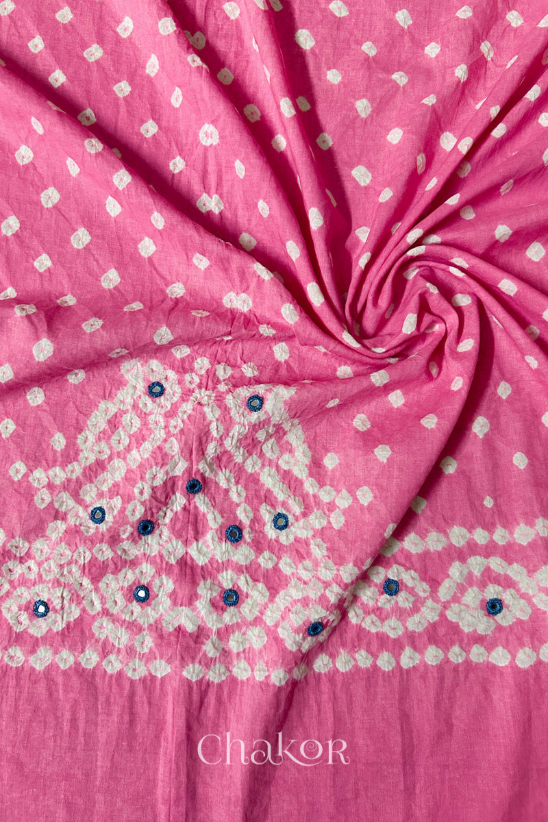 Pink Bandhani cambric cotton blouse fabric showing its soft drape and hand-tied pattern.
