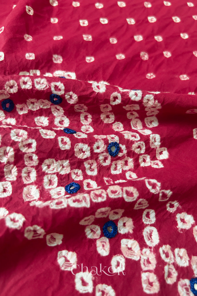 Detailed Popat Bandhani pattern with hand-embroidered mirrors on Strawberry pink cambric cotton blouse piece.
