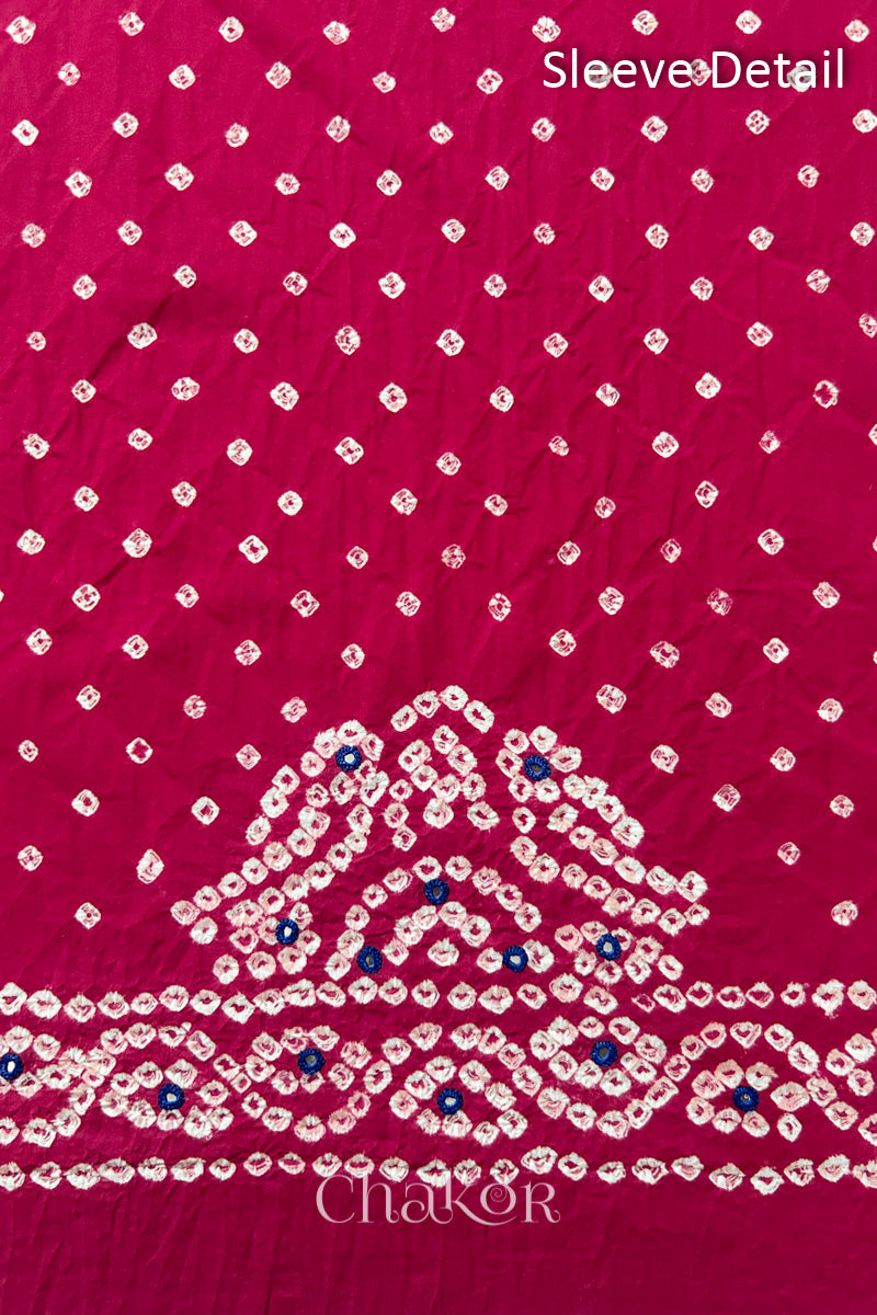 Popat Bandhani parrot motifs and mirror work designed for the sleeve of a Strawberry pink blouse.
