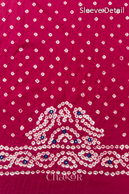 Popat Bandhani parrot motifs and mirror work designed for the sleeve of a Strawberry pink blouse.
