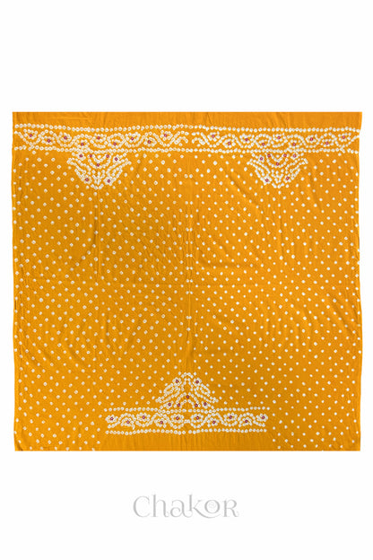 Full 1-metre layout of Yellow Popat Bandhani blouse piece showing back and sleeve motif placement.
