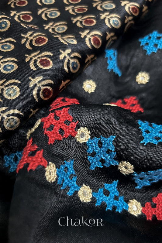 Natural dyed black Ajrakh printed Mashru silk-cotton blouse material with  Traditional Kutch hand embroidery and mirror work.