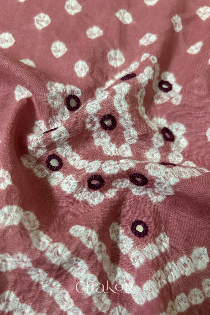 Detail of Kutch Bandhani Keri pattern with mirror embroidery on Old Rose cotton blouse fabric.
