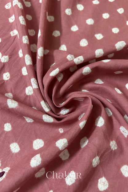 Old Rose Bandhani cotton blouse fabric showing fine tie-dye dots and its soft drape.
