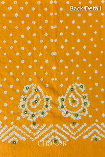 Close-up of yellow Kutch Bandhani fabric with white dotted pattern and Keri motifs for back.
