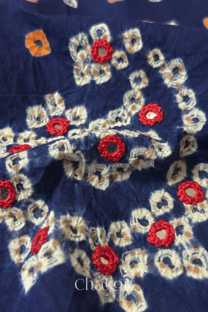 Close-up of Navy Kutch Bandhani blouse fabric showing Keri motifs and hand-embroidered mirror work.
