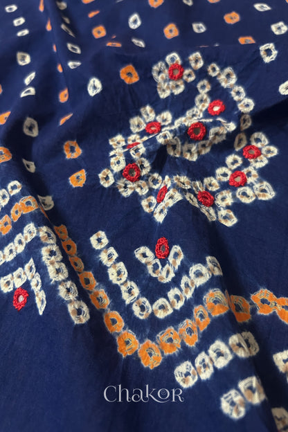 Detail of Kutch Bandhani Keri pattern with mirror embroidery on Navy cotton blouse fabric.
