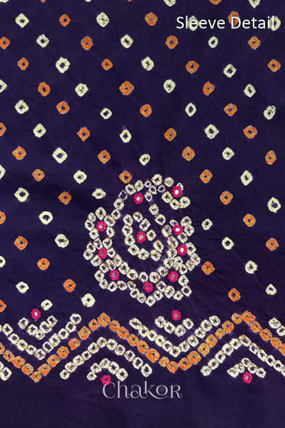 Purple Kutch Bandhani cotton fabric with white tie-dye dots and Keri motif detail for sleeves.
