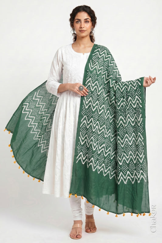 Moss green Kutch Bandhani dupatta with mukaish embroidery in mercerised mulmul cotton shown in side drape styling.
