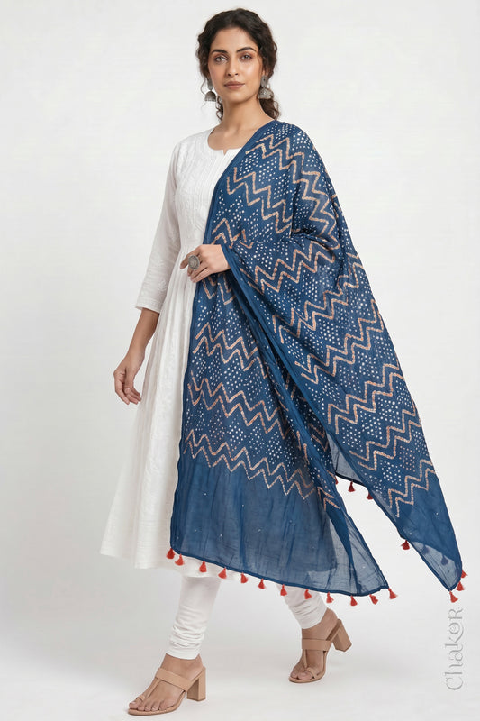 Indigo Blue Kutch Bandhani dupatta with mukaish embroidery in mercerised mulmul cotton shown in side drape styling.

