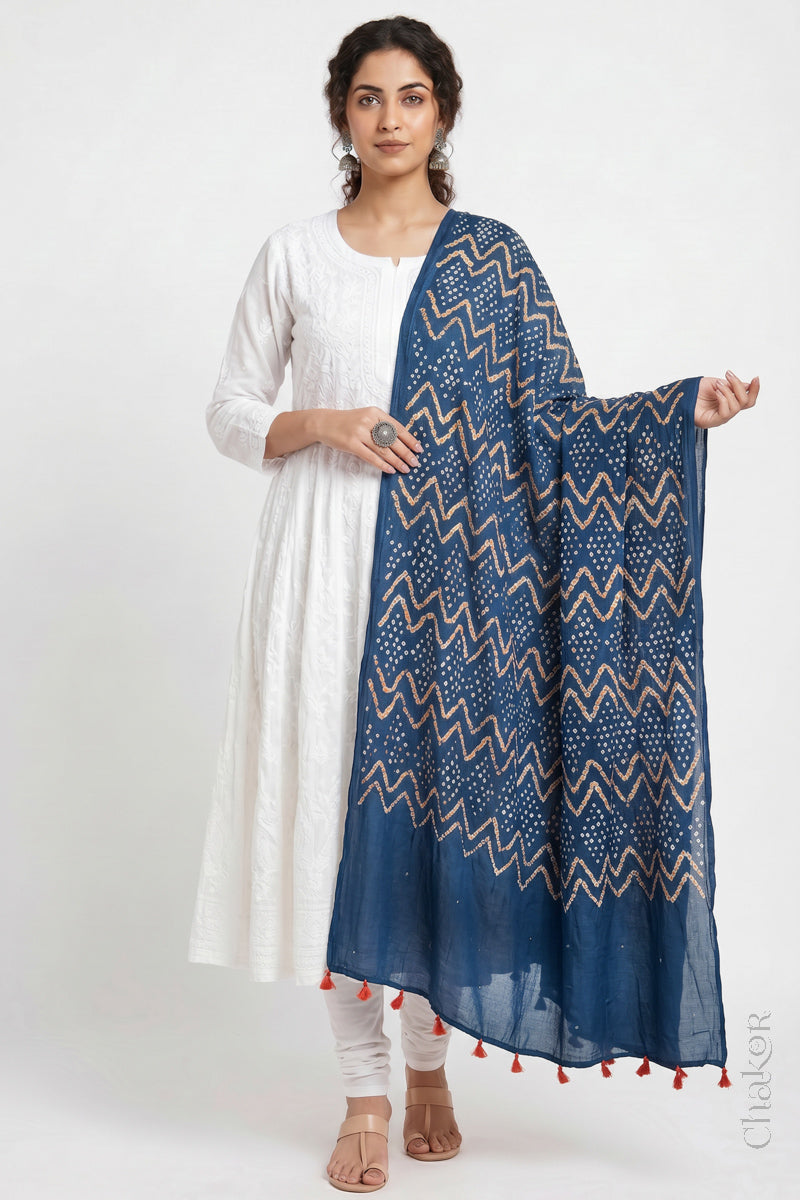 Indigo Blue Kutch Bandhani dupatta with mukaish embroidery in lightweight mercerised mulmul cotton with flowing drape.
