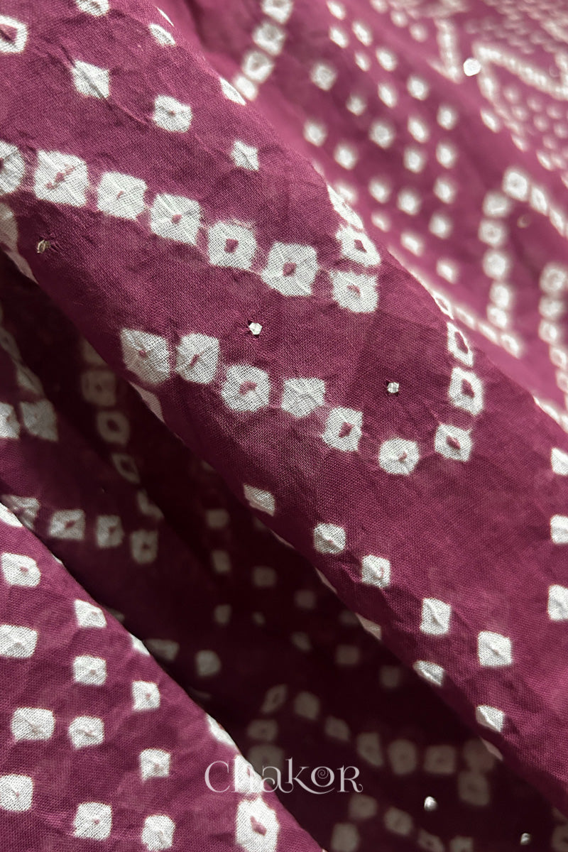 Full view of Plum pink Kutch Bandhani dupatta with mukaish embroidery in pure mercerised mulmul cotton.
